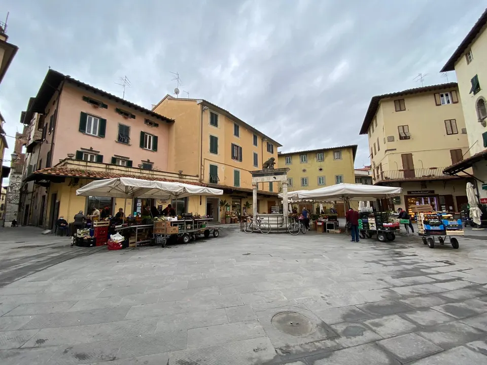 This photo represents Piazza della Sala in Pistoia (Tuscany, Italy) during the fruit and vegetable market's day.